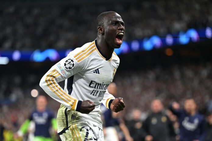 MADRID, SPAIN - MAY 08: Ferland Mendy celebrates after Joselu of Real Madrid scored his sides first goal during the UEFA Champions League semi-final second leg match between Real Madrid and FC Bayern München at Estadio Santiago Bernabeu on May 08, 2024 in Madrid, Spain.