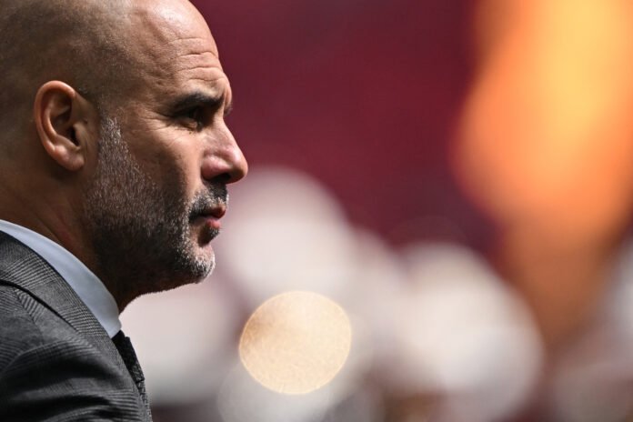 Manchester City's Spanish manager Pep Guardiola reacts as he arrives on the pitch prior to the English FA Cup final football match between Manchester City and Manchester United at Wembley stadium, in London, on May 25, 2024.