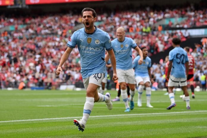 LONDON, ENGLAND - AUGUST 10: Bernardo Silva of Manchester City celebrates scoring his team's first goal during the 2024 FA Community Shield match between Manchester United and Manchester City at Wembley Stadium on August 10, 2024 in London, England.