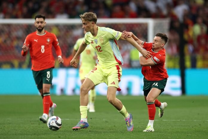 MUNICH, GERMANY - JUNE 08: Dean Huijsen of Spain is challenged by Francisco Conceicao of Portugal during the UEFA Nations League 2025 final match between Portugal and Spain at Munich Football Arena on June 08, 2025 in Munich, Germany.
