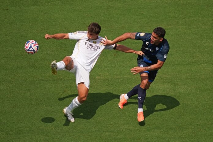 CHARLOTTE, NORTH CAROLINA - JUNE 22: Gonzalo Garcia #30 of Real Madrid C.F. battles for possession with Federico Pereira #16 of CF Pachuca during the FIFA Club World Cup 2025 group H match between Real Madrid CF and CF Pachuca at Bank of America Stadium on June 22, 2025 in Charlotte, North Carolina.