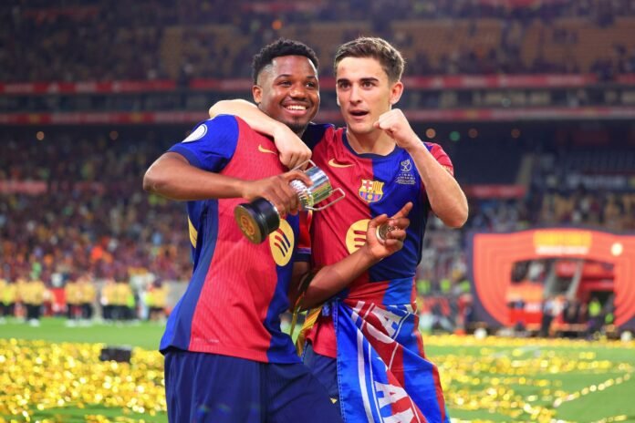 SEVILLE, SPAIN - APRIL 26: Ansu Fati and Gavi of FC Barcelona celebrate after the team's victory in the Copa del Rey Final match between FC Barcelona and Real Madrid at Estadio de La Cartuja on April 26, 2025 in Seville, Spain.