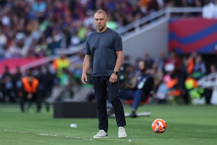 BARCELONA, SPAIN - MAY 18: Hansi Flick, Head Coach of FC Barcelona, looks on during the La Liga EA Sports match between FC Barcelona and Villarreal CF at Estadi Olimpic Lluis Companys on May 18, 2025 in Barcelona, Spain.