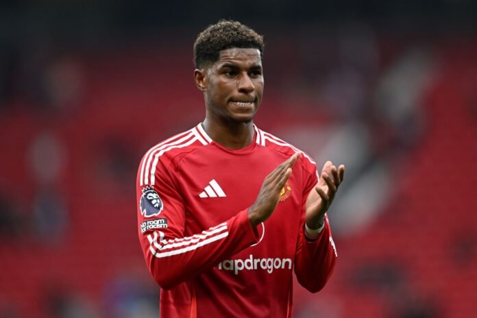 MANCHESTER, ENGLAND - SEPTEMBER 01: Marcus Rashford of Manchester United, acknowledges the fans, following the teams defeat to Liverpool after the Premier League match between Manchester United FC and Liverpool FC at Old Trafford on September 01, 2024 in Manchester, England.