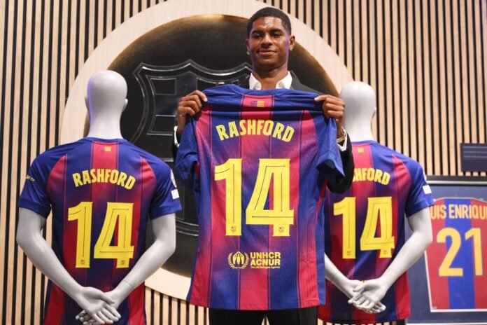 BARCELONA, SPAIN - JULY 23: Marcus Rashford of FC Barcelona holds up his shirt during the Unveiling of New Signing Marcus Rashford, after the announcement of a season-long loan move from Manchester United to FC Barcelona, at Camp Nou on July 23, 2025 in Barcelona, Spain.