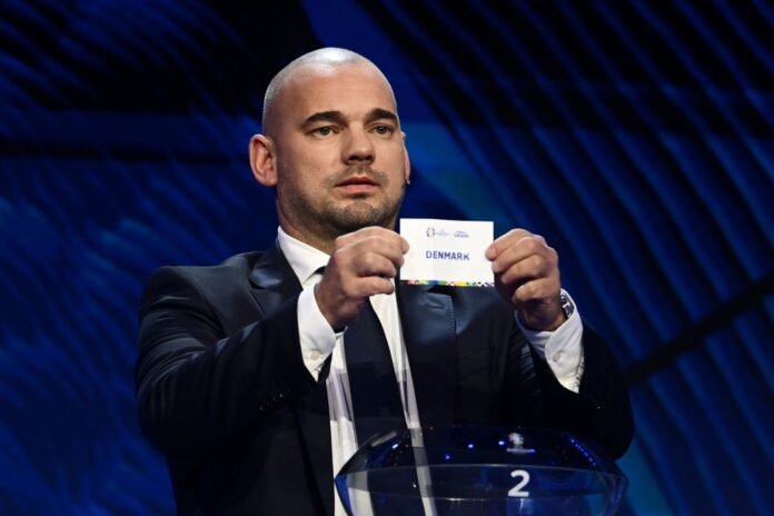 HAMBURG, GERMANY - DECEMBER 02: Special guest Wesley Sneijder​​ pulls out the card of Denmark during the UEFA EURO 2024 Final Tournament Draw at Elbphilharmonie on December 02, 2023 in Hamburg, Germany.