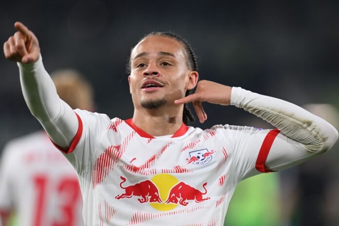 WOLFSBURG, GERMANY - APRIL 11: Xavi Simons of RB Leipzig celebrates scoring his team's third goal during the Bundesliga match between VfL Wolfsburg and RB Leipzig at Volkswagen Arena on April 11, 2025 in Wolfsburg, Germany.