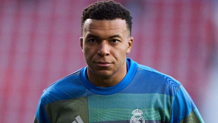 Kylian Mbappe of Real Madrid looks on during the warm up prior to the LaLiga EA Sports match between CA Osasuna and Real Madrid CF at Estadio El Sadar on February 21, 2026 in Pamplona, Spain.