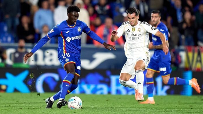Coba da Costa of Getafe CF is challenged by Brahim Diaz of Real Madrid during the LaLiga EA Sports match between Getafe CF and Real Madrid CF at Coliseum Alfonso Perez on October 19, 2025 in Getafe, Spain.