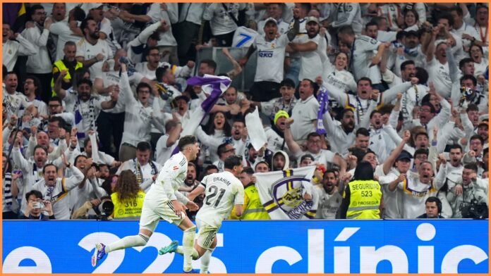 MADRID, SPAIN - MARCH 22: Vinicius Junior of Real Madrid celebrates scoring his team's first goal during the LaLiga EA Sports match between Real Madrid CF and Atletico de Madrid at Estadio Santiago Bernabeu on March 22, 2026 in Madrid, Spain.